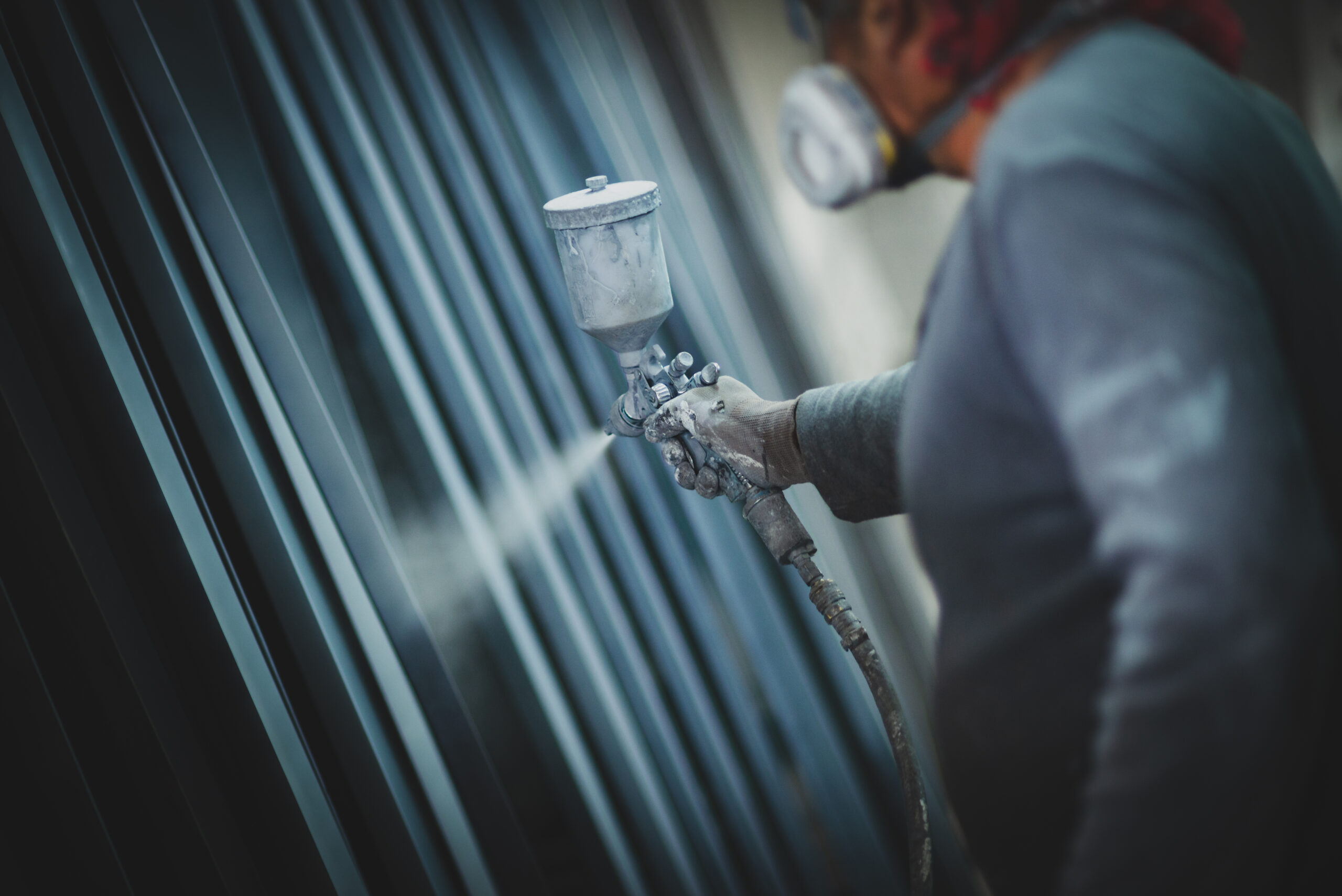 Man,Painting,Metal,Products,With,A,Spray,Gun